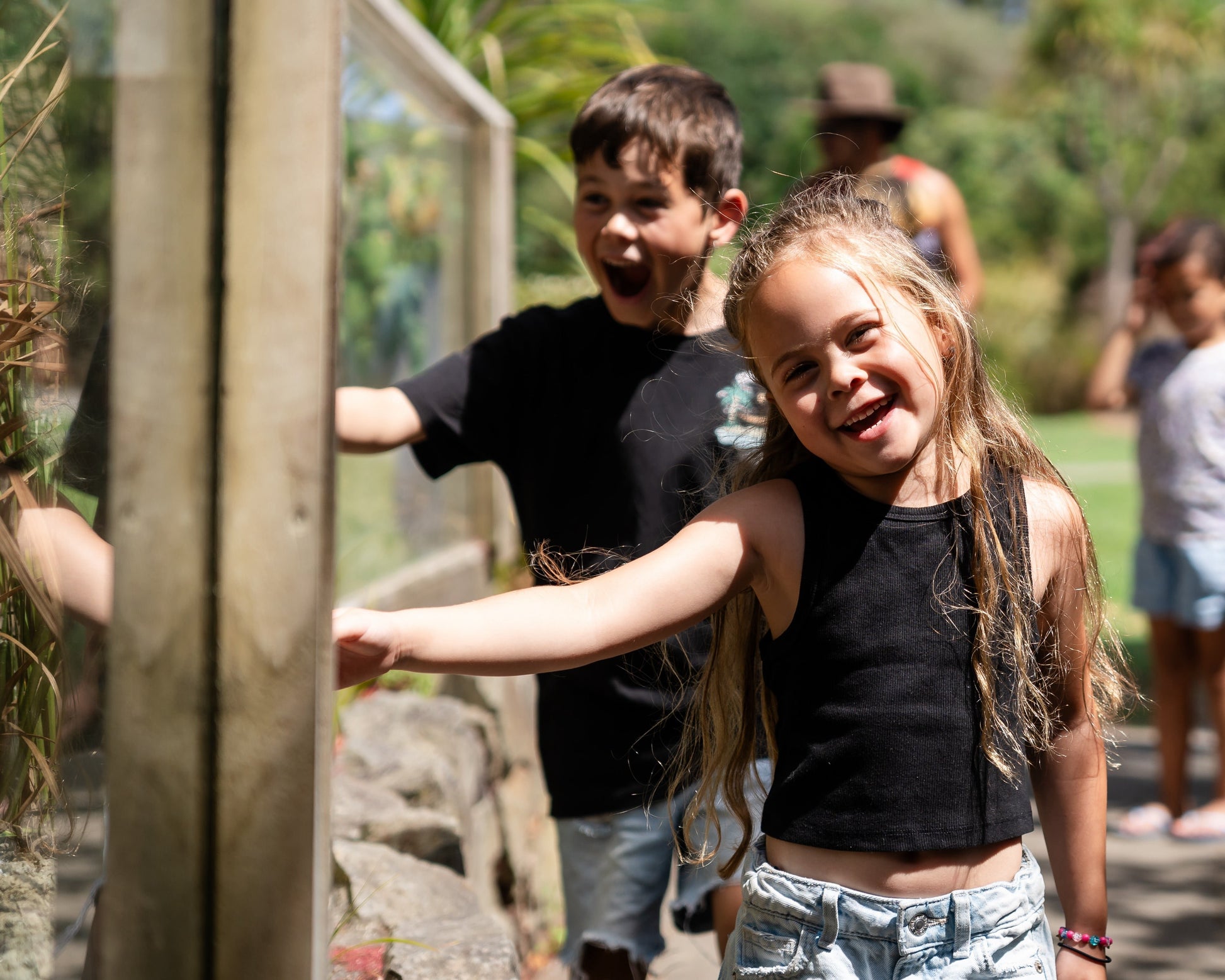 Kids looking into the Tuatara enclosures  at Ngā Manu nature reserve in Waikanae on the Kāpiti coast.